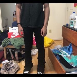 Stacked black sweatpants